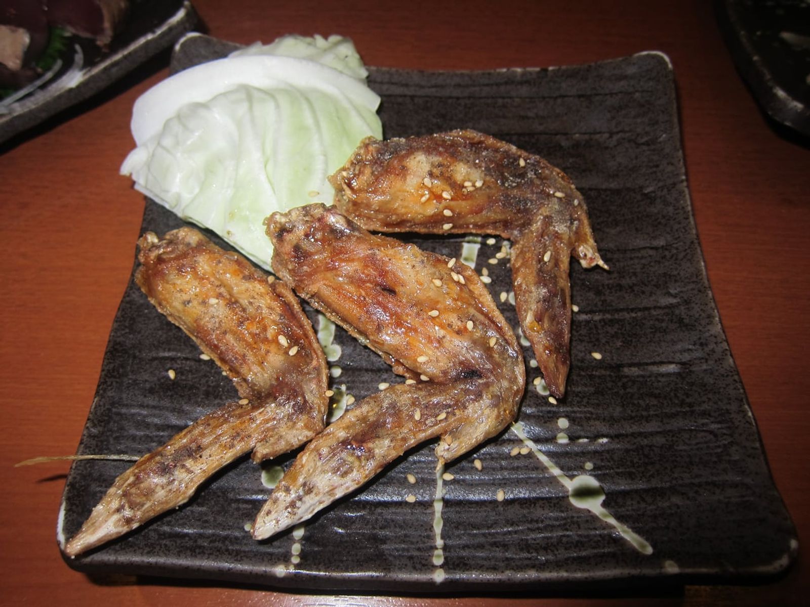 Nagoya-style tebasaki (fried chicken wings) · Photo: Geographer / CC BY-SA 3.0 (Wikimedia Commons)